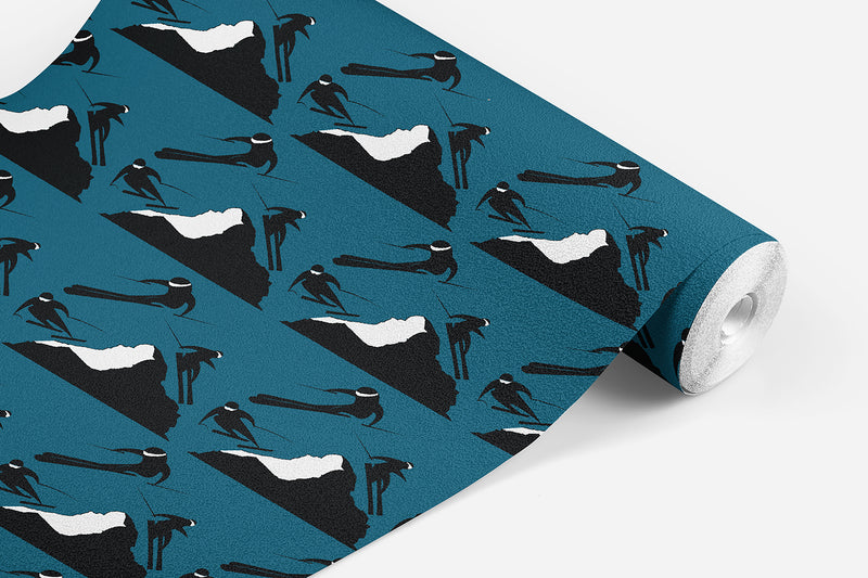 roll of Off Piste wallpaper which has black and white skiers on either side of a mountain on a teal background