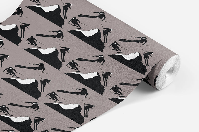 roll of Off Piste wallpaper which has black and white skiers on either side of a mountain on a mocha background