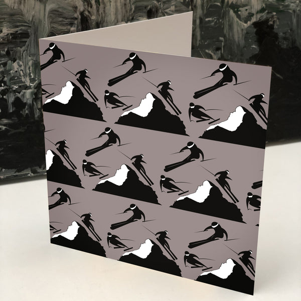 Off Piste greeting card in taupe with skiers coming down a mountain in black 