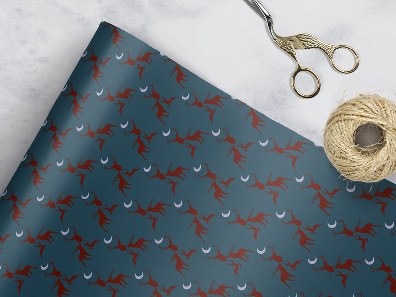 teal Wrapping paper with 3 red stags and a grey moon 
