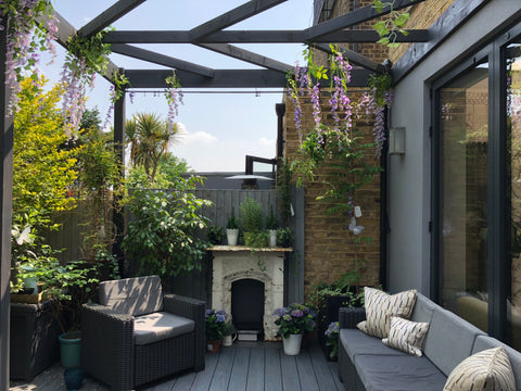 outdoor fireplace and patio by fleur ward interior design